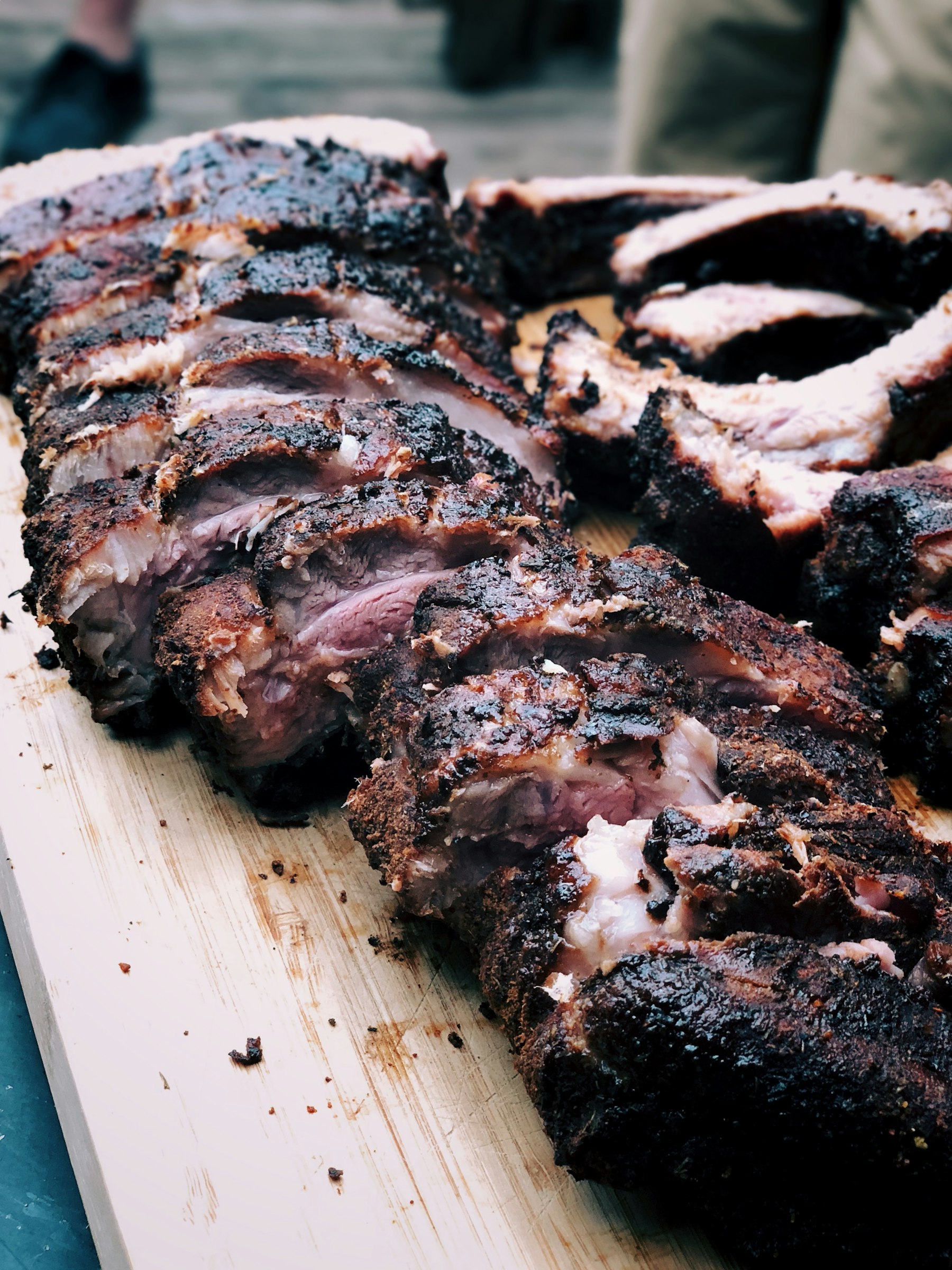 Cooked ribs on a wooden board